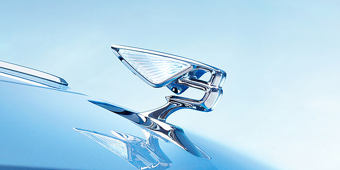 Bentley Casablanca Bentley Flying Spur Azure sedan bonnet close up in Light Windsor Blue paint with Illuminated Flying B mascot