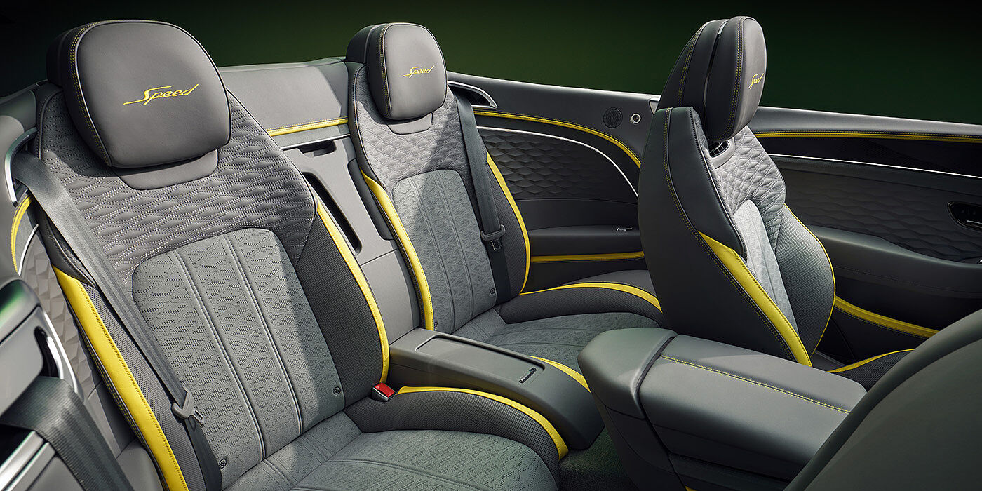 Bentley Casablanca Bentley New Continental GTC Speed convertible rear interior with unique Speed colour split in Gravity Grey and Cyber Yellow hide colours, and contrast stitched headrest emblems 