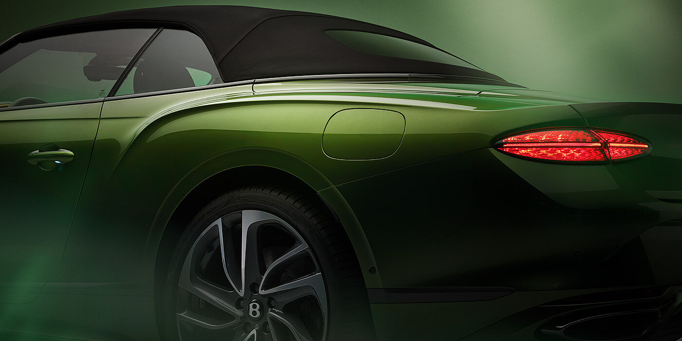 Bentley Casablanca Bentley New Continental GTC Speed rear haunch and tail lamp in Tourmaline Green paint and dark tint brightware with black hood up and illuminated head lamps
