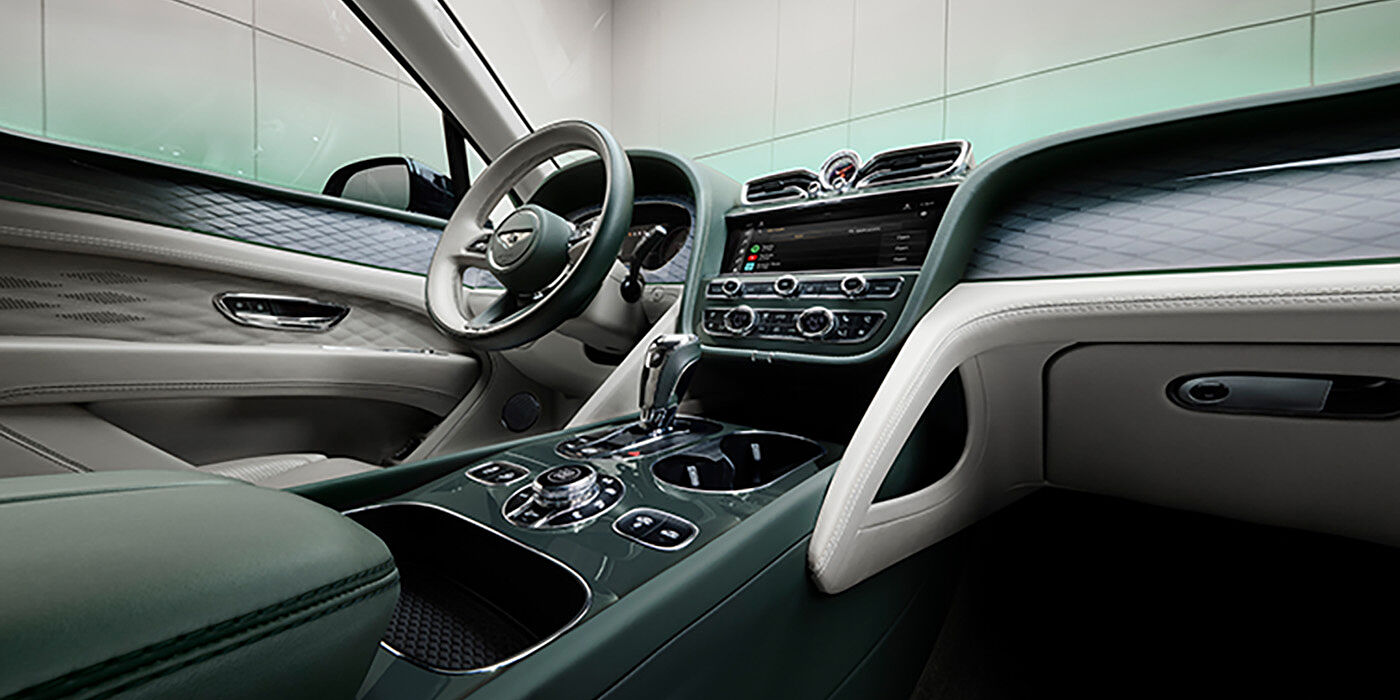Bentley Casablanca Bentley Bentayga Atelier Edition SUV front interior in Portland and Cumbrian Green hides with Dark Tint Diamond Brushed Aluminium veneer