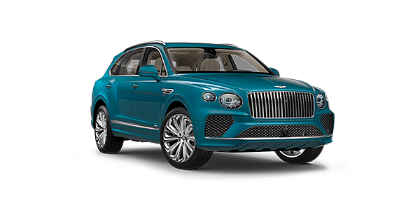 Bentley Casablanca Bentley Bentayga Azure luxury SUV rear three quarter in Topaz Blue by Mulliner paint, driving on an ocean road.