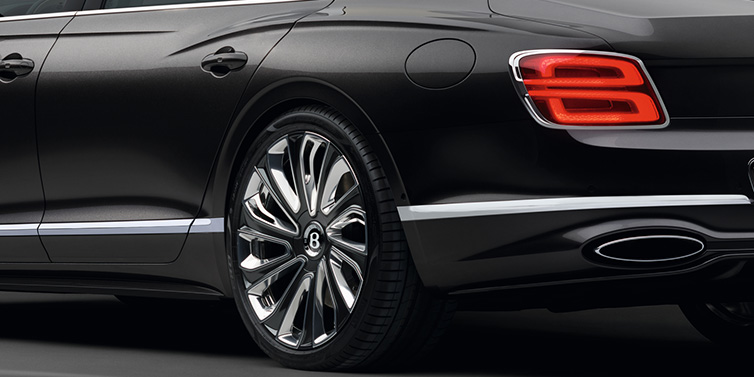 Bentley Casablanca Bentley Flying Spur Mulliner sedan rear side exterior detail in Magnetic paint and 22 inch Mulliner painted and polished wheel