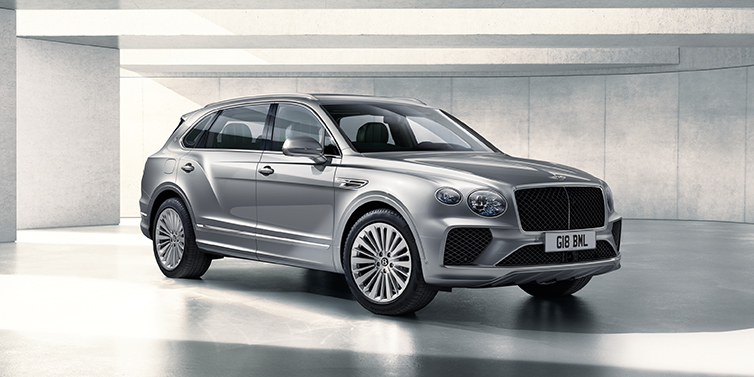 Bentley Casablanca Bentley Bentayga Extended Wheelbase SUV front three quarter in Moonbeam paint with a grey background