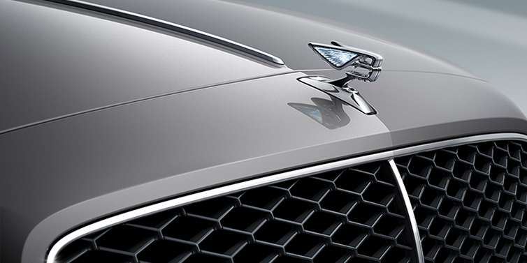 Bentley Casablanca New Bentley Flying Spur sedan bonnet detail in Silverlake paint with Illuminated Flying B bonnet badge and matrix grille with chrome surround