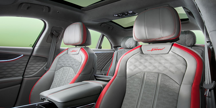 Bentley Casablanca Bentley Flying Spur Speed sedan interior showing front and rear seats in Hotspur red and Gravity Grey hides, with Speed seat emblems