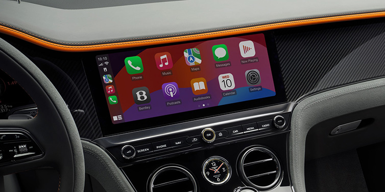 Bentley Casablanca Bentley Continental GT Speed coupe front interior centre console with MMI screen featuring Apps surrounded by Mandarin by Mulliner and Gravity Grey hides