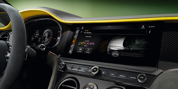 Bentley Casablanca Bentley Continental GTC Speed convertible front interior centre console with MMI screen showing Air Quality visualisation surrounded by Cyber Yellow by Mulliner and Gravity Grey hides and high gloss carbon fibre veneer