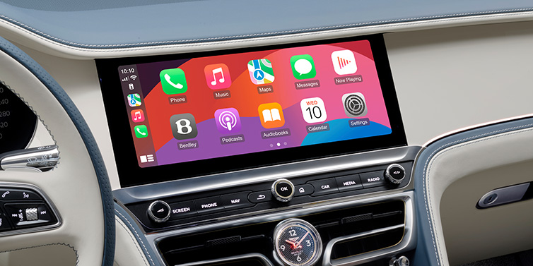 Bentley Casablanca New Bentley Flying Spur Azure sedan front cabin central MMI screen showing available services against Linen and Brunel hides and Piano Linen veneer
